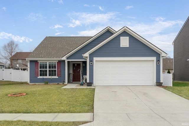 view of front of house featuring a garage and a front lawn