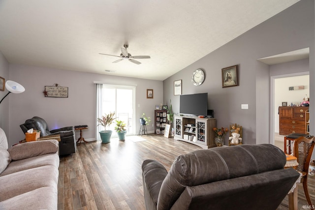 living room featuring lofted ceiling, wood-type flooring, and ceiling fan