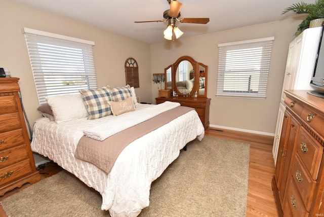 bedroom featuring ceiling fan and light hardwood / wood-style flooring