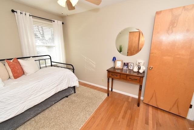 bedroom featuring ceiling fan and light hardwood / wood-style flooring