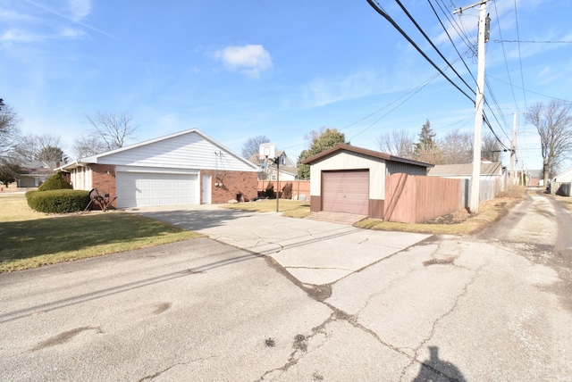 exterior space featuring a yard and a garage