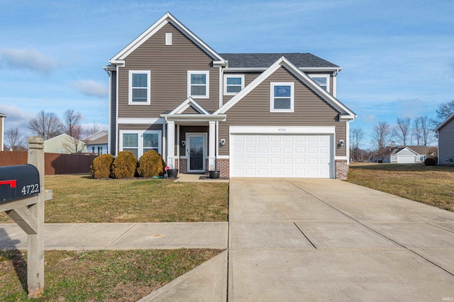 view of front of property with a garage and a front yard