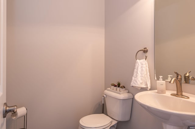 bathroom featuring sink and toilet