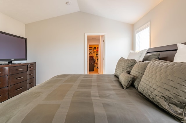 bedroom with lofted ceiling