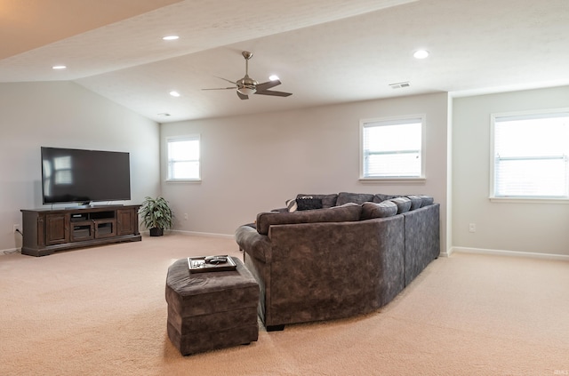 living room with light carpet, lofted ceiling, and ceiling fan