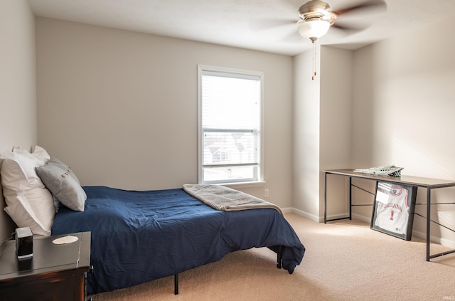 bedroom with light carpet and ceiling fan