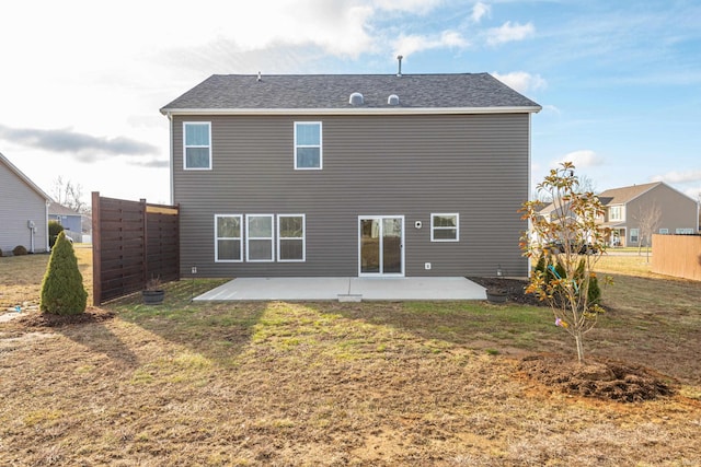 back of house featuring a yard and a patio area