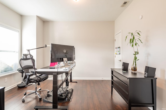 home office with dark wood-type flooring