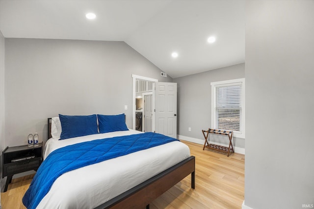 bedroom featuring lofted ceiling and hardwood / wood-style floors