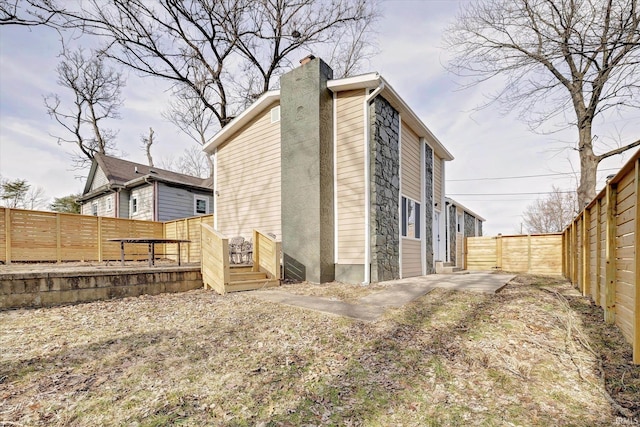 rear view of property featuring a patio