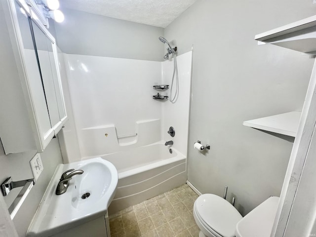 full bathroom featuring sink, shower / tub combination, toilet, and a textured ceiling