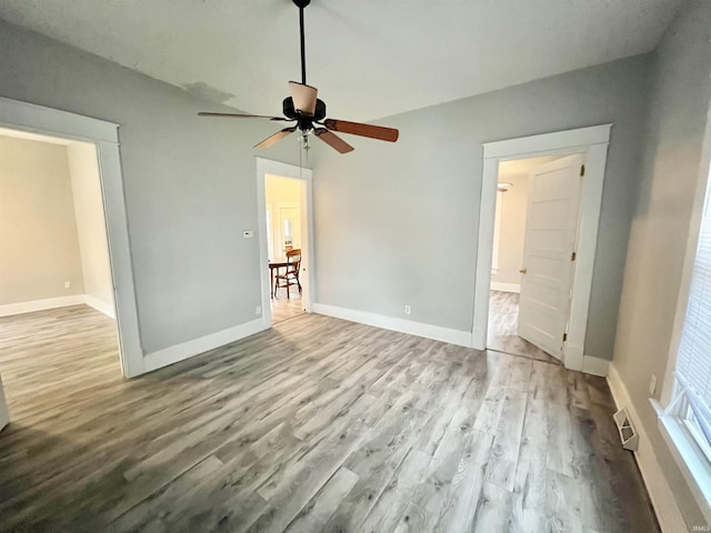 interior space featuring ceiling fan and light hardwood / wood-style flooring