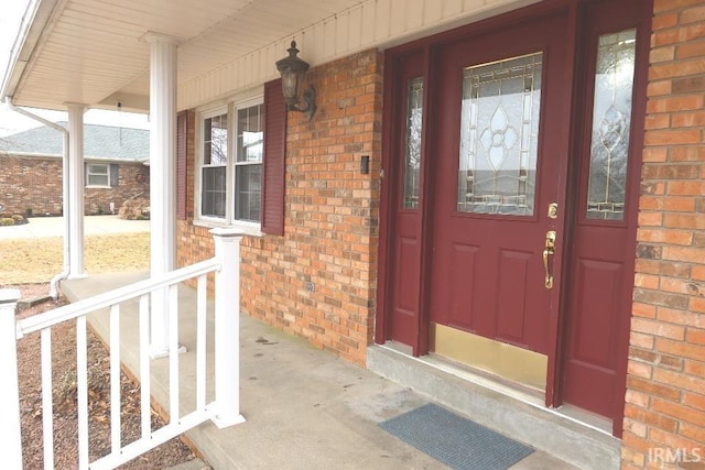 property entrance featuring covered porch