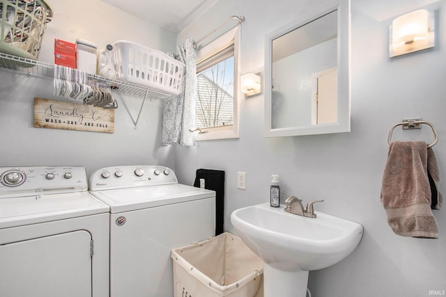 washroom featuring sink and washer and clothes dryer