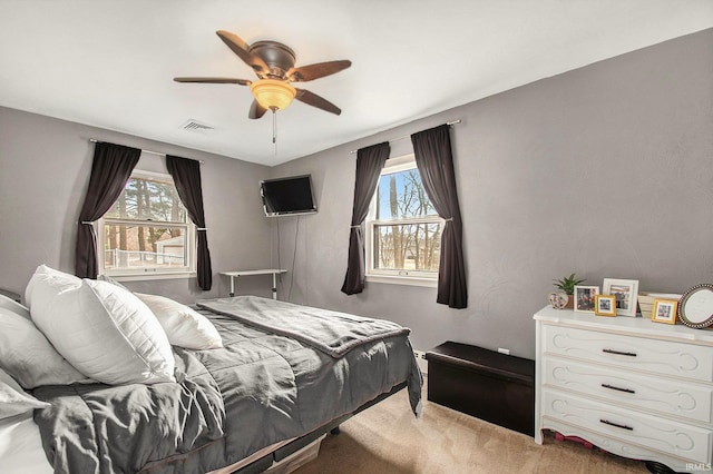 carpeted bedroom featuring ceiling fan