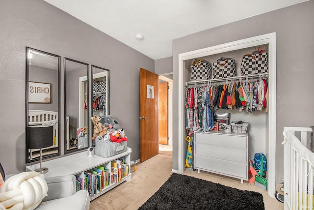 carpeted bedroom with a closet