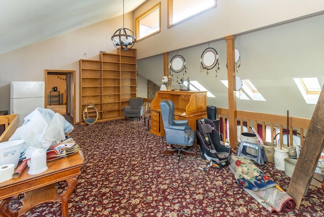 misc room featuring a skylight, high vaulted ceiling, carpet flooring, a notable chandelier, and ornate columns