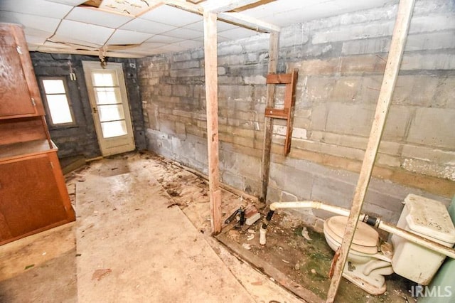 basement with a paneled ceiling