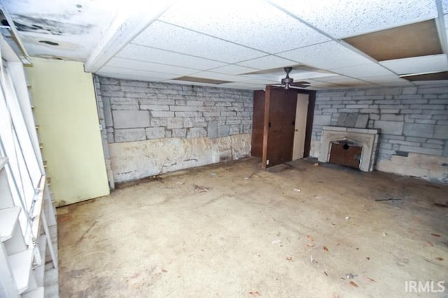 basement featuring a drop ceiling