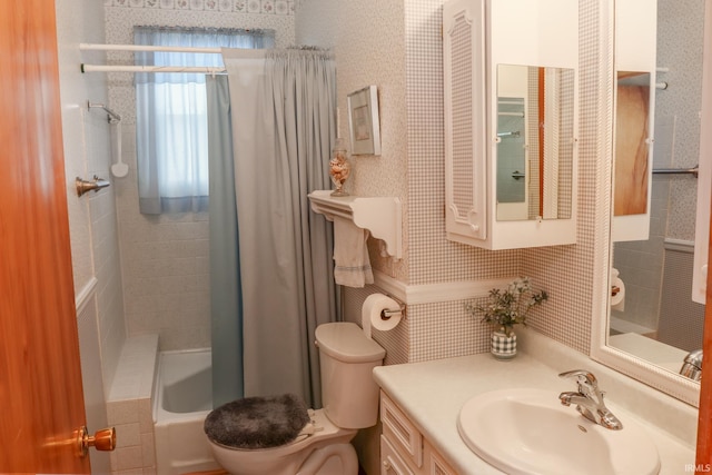 full bathroom featuring shower / bath combo, vanity, and toilet