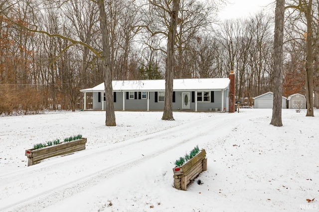 view of front facade with a garage and an outdoor structure