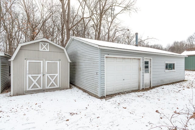 view of snow covered garage