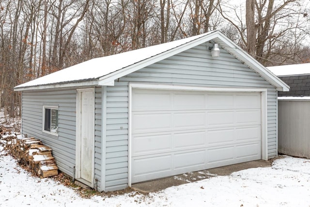 view of snow covered garage