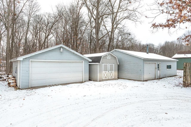 view of snow covered garage