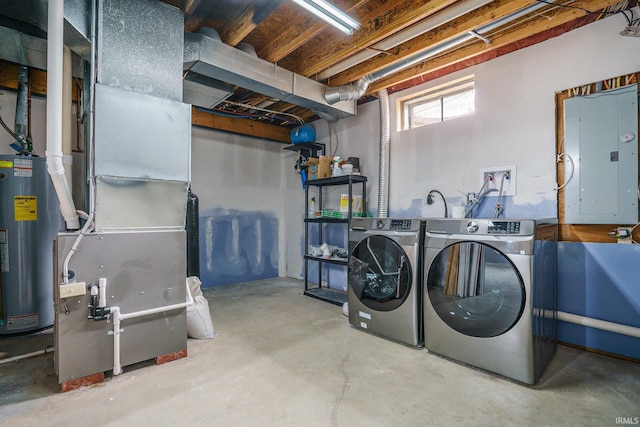 clothes washing area featuring water heater, separate washer and dryer, heating unit, and electric panel