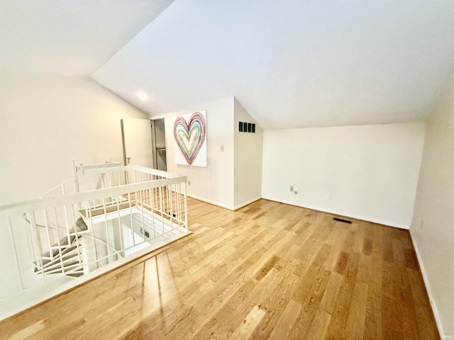 interior space with lofted ceiling and wood-type flooring