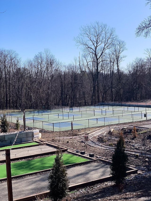 exterior space featuring tennis court