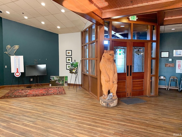 interior space featuring hardwood / wood-style floors and a paneled ceiling