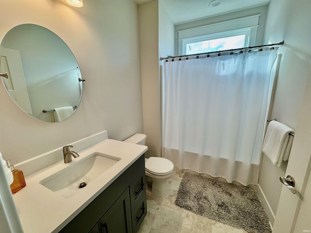 full bathroom with vanity, shower / bath combo, and toilet