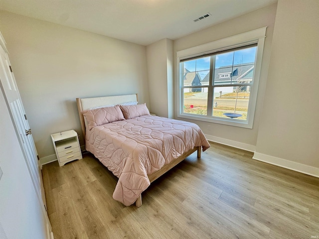 bedroom featuring light wood-type flooring