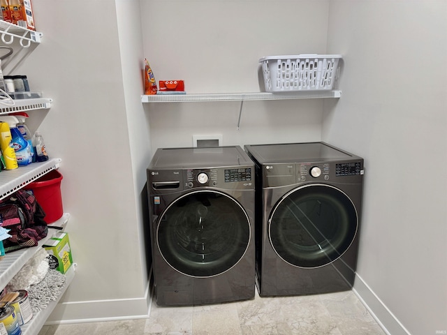 clothes washing area featuring washing machine and clothes dryer