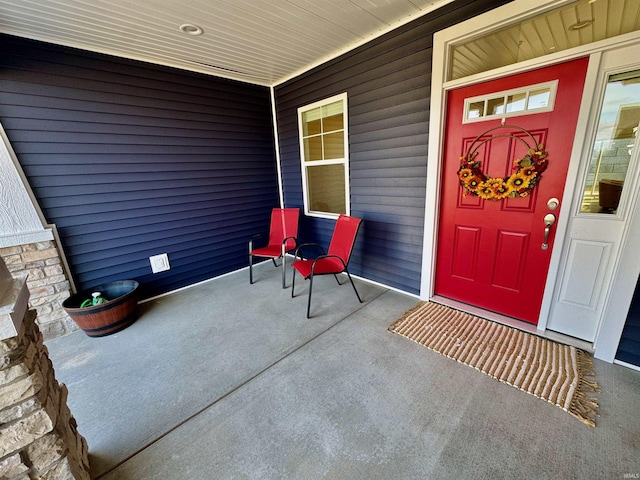 entrance to property featuring a porch