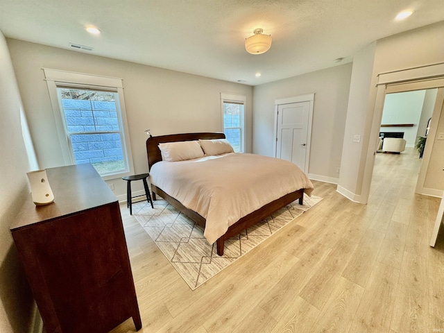 bedroom with light hardwood / wood-style floors