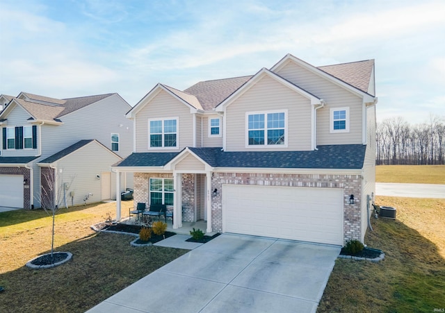 view of front of house featuring central AC, a garage, and a front lawn