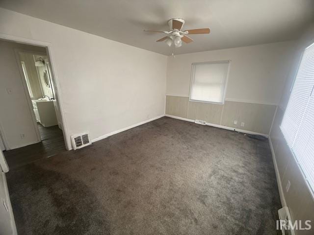 carpeted empty room with ceiling fan