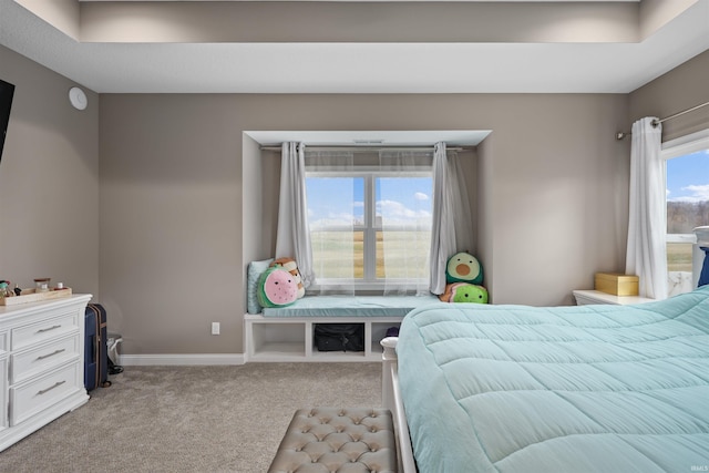 bedroom featuring light carpet