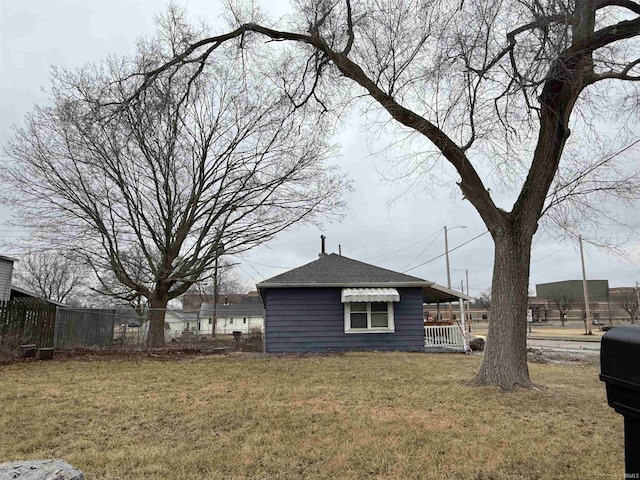 view of property exterior with a lawn