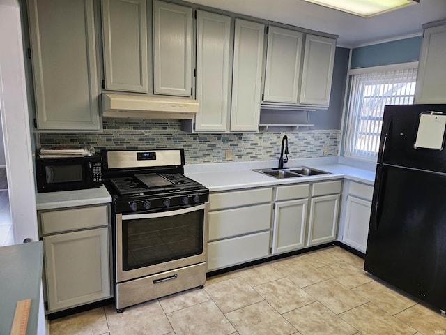 kitchen with gray cabinetry, sink, decorative backsplash, and black appliances