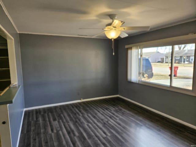 unfurnished room with dark hardwood / wood-style floors and ceiling fan