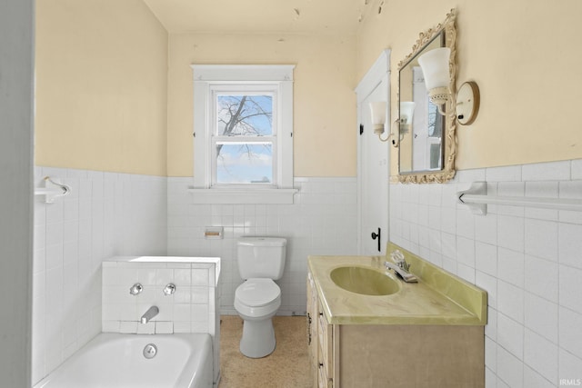 bathroom with a tub to relax in, toilet, vanity, and tile walls