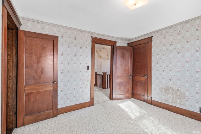 unfurnished bedroom featuring light colored carpet