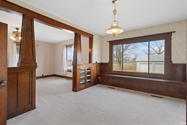 spare room featuring light colored carpet