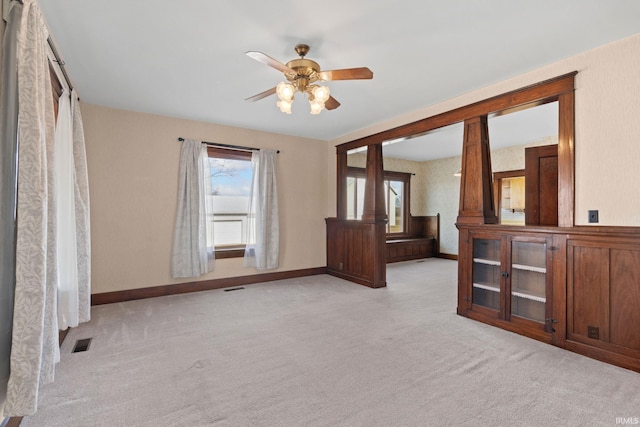 carpeted empty room with ceiling fan