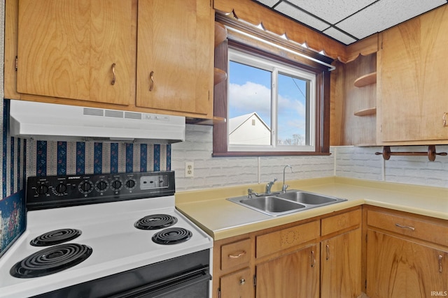 kitchen featuring a paneled ceiling, sink, and electric range oven