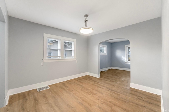 spare room with light hardwood / wood-style flooring