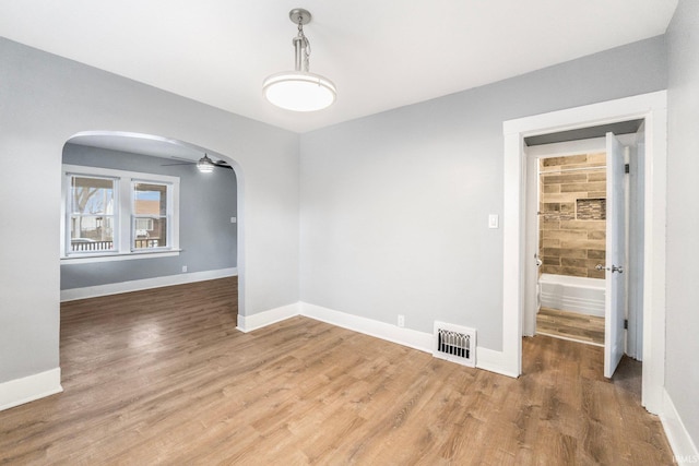 empty room featuring hardwood / wood-style flooring